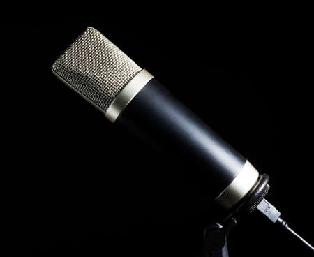 Microphone and stand with connection behind on blackの写真素材
