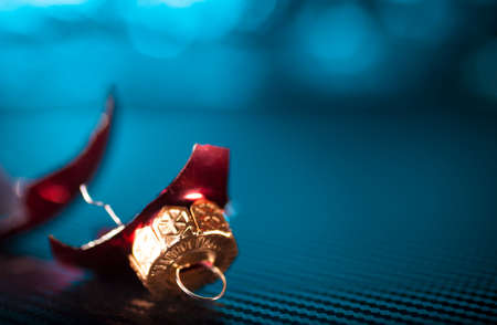 Broken glass ornament from the Christmas tree on a blue backgroundの写真素材