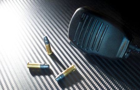 Three rim fire bullets with a police style microphone