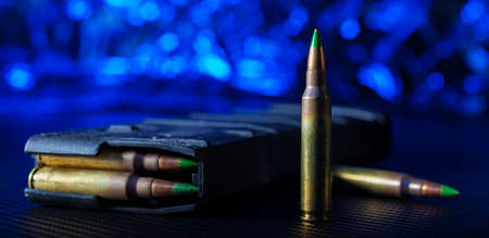 Cartridges and polymer magazine for an AR-15 with blue behindの写真素材