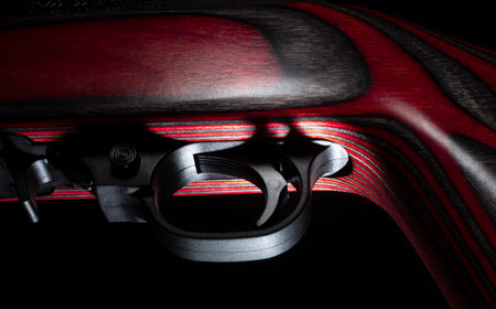 Trigger on a semi auto rifle on a black background
