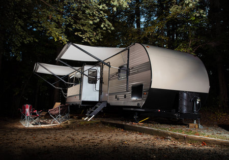 Travel trailer in early autumn set up at a campsite at Falls Lake North Carolina