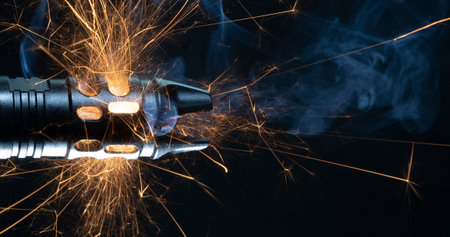 Smoke and sparks flying from the barrel of a gun