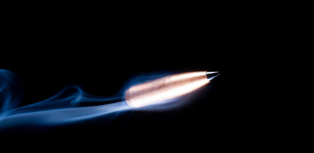 Speeding bullet with smoke behind on black with room for text above