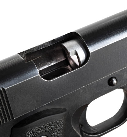 Empty chamber on a semi-automatic pistol isolated on a white background
