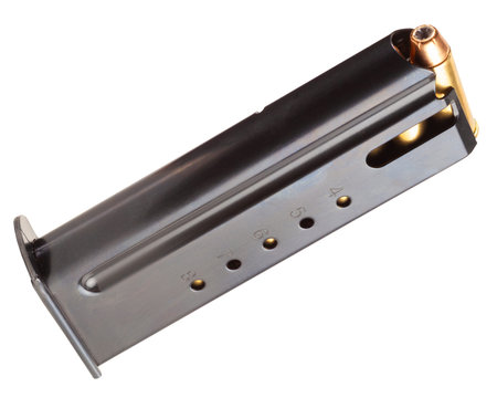 Gun magazine full length with hollow point bullets isolated on a white background
