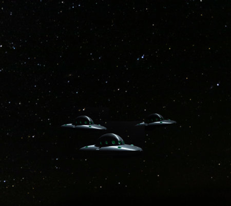 Formation of three UFOs with stars and copy space aboveの写真素材