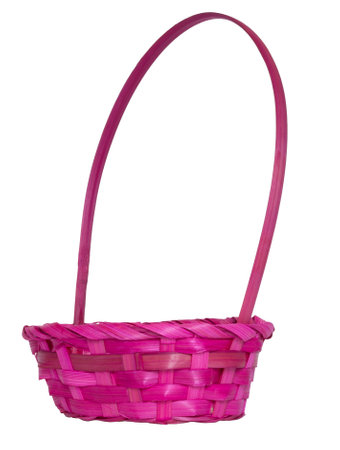 Pink wicker Easter basket that is empty with plenty of copy space on an isolated background.の写真素材