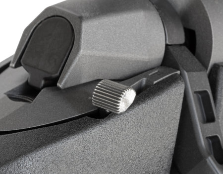Textured surface showing clearly on the safety near the bolt of a high powered bolt action rifle isolated on a white background.の写真素材