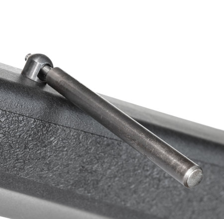 Black and grey polymer stock on a rifle with its sling swivel stud being removed with the process isolated on white background.の写真素材