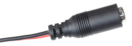 Studio photo of a DC power connector that is the female ense seen in a close up isolated on a white background.の写真素材
