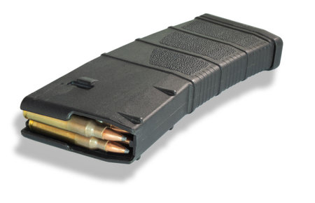 Dropshadow under a fully loaded AR-15 magazine that is high capacity with shadow underneath isolated on a white background.の写真素材