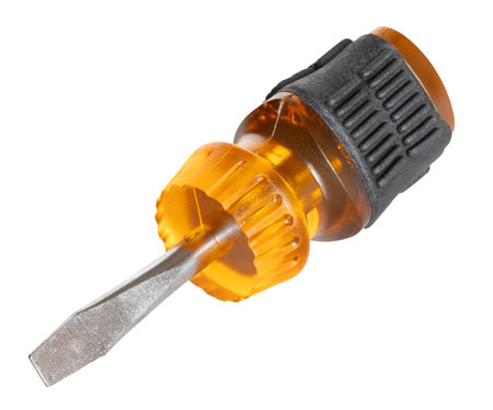 Yellow body and rubber grip on a flat headed screwdriver, isolated, with a transparent yellow plastic body and black yellow padding on the grip.の写真素材