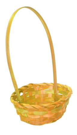 Isolated in a studio photo this yellow wicker Easter basket is empty.の写真素材