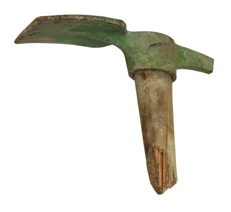 Very old pick axe that is broken in two places and covered in rust and green color isolated on a white background.の写真素材