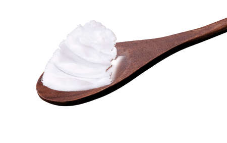 Rustic wooden spoon with pork fat, isolated on white background.の写真素材