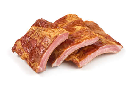 Smoked pork ribs, close-up, isolated on white background.の写真素材