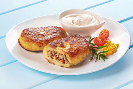 Potato pancakes with meat with sour creamの写真素材