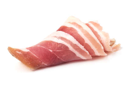 Twisted pieces of pork farmer meat or bacon, isolated on white backgroundの写真素材