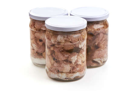 Canned meat in a glass jar, isolated on white backgroundの写真素材