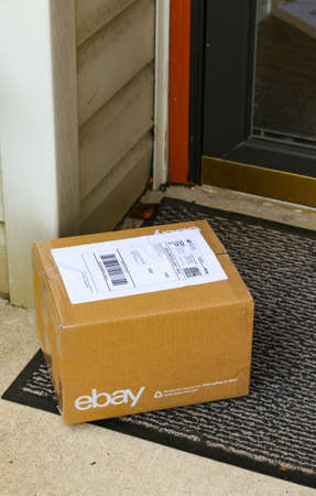 Lancaster, PA, USA - December 4, 2017: An ebay package delivered at a front residential door.のeditorial素材