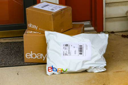 Lancaster, PA, USA - December 4, 2017: Multiple ebay packages delivered to a residential front door.のeditorial素材