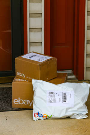 Lancaster, PA, USA - December 4, 2017: Multiple ebay packages delivered to a residential front door.のeditorial素材