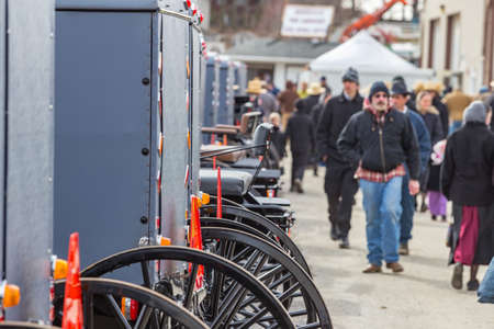 Bart, PA, USA - March 3, 2018: A line of Amish buggies to be sold at the annual Mud Sale at the Bart Fire Company.のeditorial素材