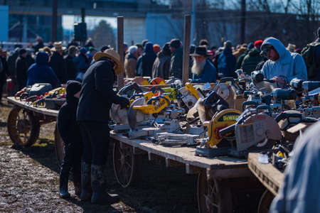 Gordonville, PA, USA - March 10, 2018: Farm wagons with some of the items to be sold at the annual Lancaster County Mud Sale at the Gordonville Fire Company.のeditorial素材