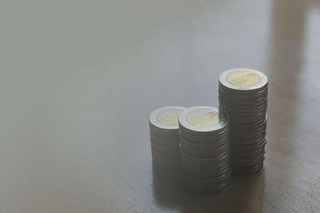 Thai bath coin money put together near the window, natural lighting.の写真素材