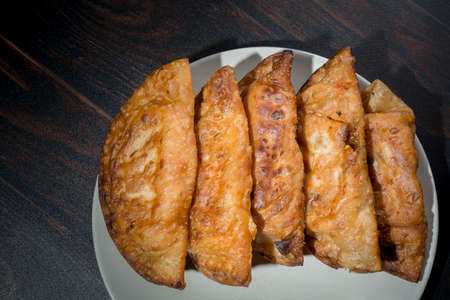 Tuna pie is a traditional tapa in Spain. Each family makes their homemade recipe and the tuna filling with tomato and onion changes from region to regionの写真素材