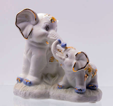 Figurine of Two Elephant on white Backgroundの写真素材