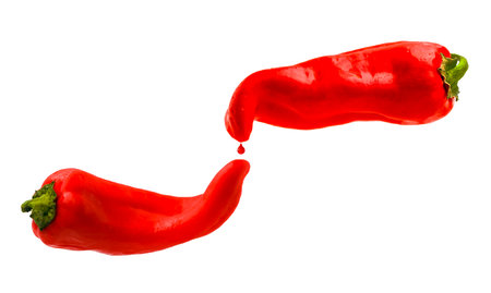 Red peppers with red drop isolated on a white background