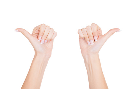 Showing direction  Close-up of female hands gesturing while isolated on white backgroundの写真素材