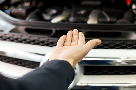 Here is your new car. Close-up shoot of the hand presenting a carの写真素材