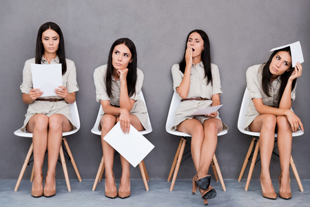 Digital composite of young businesswoman expressing different emotions while holding paper and sitting at the chair against grey background