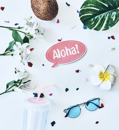 Hello summer! High angle shot of eyewear, coconut and flower lying against white backgroundの写真素材