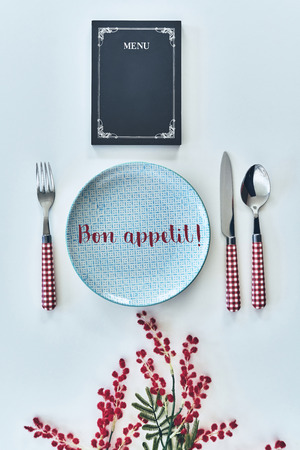 Bon appetit! High angle food concept shot of restaurant stuff on white backgroundの写真素材
