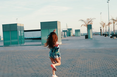 So much fun! Attractive young woman feeling free while running outdoors