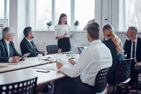 Professional business expert conducting meeting while working together with colleagues in the modern officeの写真素材