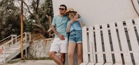 Beautiful loving couple embracing while relaxing outdoors togetherの写真素材