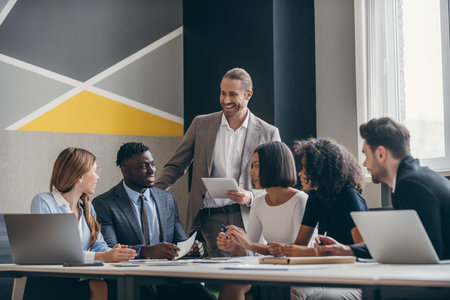 Smiling business team planning strategy while working at the modern office together