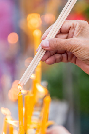 People are lighting incense stick to pray for goodness