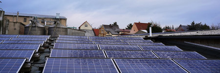 alternative electricity source. Photovoltaic solar panels covered with snow on rooftop house. Renewable energy production. Resources ecological power plant.の写真素材