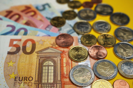 Euro cash money background, coins and banknotes, close up, soft focus.の写真素材