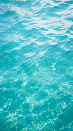 Sunlight Dancing on Swimming Pool Water. Gentle waves in ocean, highlighted by the shimmering sunlight. World Water Day concept. Clean water conservation and sustainable use of water resources.の素材