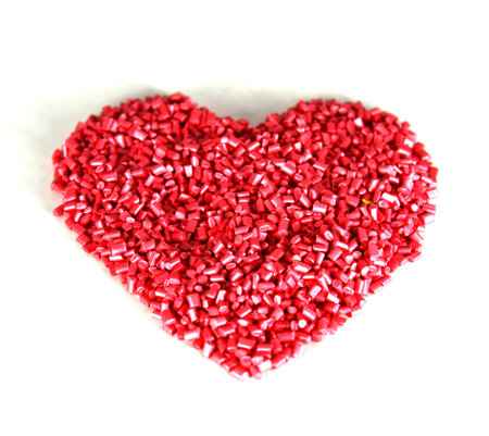 Heart shapes for Valentine’s Day and for lovers. Heart shaped plastic granules that are raw...