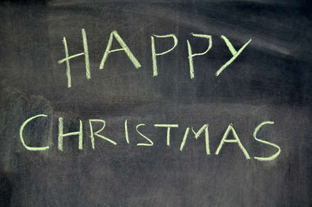 Happy christmas message is on blackboard の写真素材