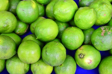 Green colored fruits are on grocery shelf.の写真素材