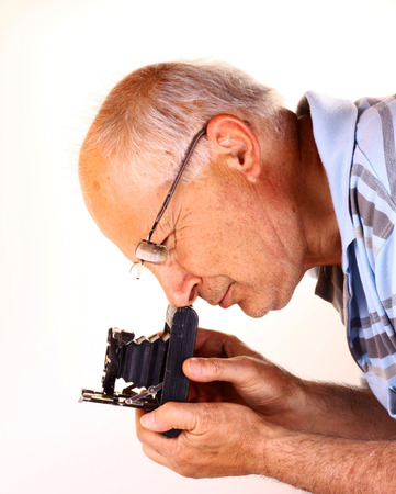 Old man shoots photos at the studio.の写真素材
